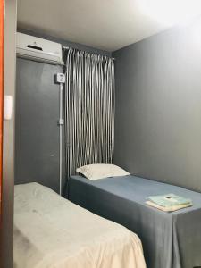 מיטה או מיטות בחדר ב-Pousada Cantinho do Sossego