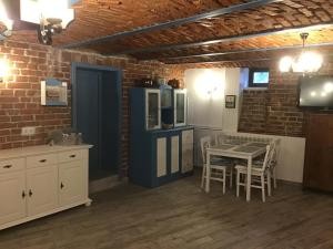 a kitchen and dining room with a table and chairs at Casa Wagner in Sibiu
