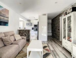 a living room with a couch and a table at Tarifabeach in Tarifa