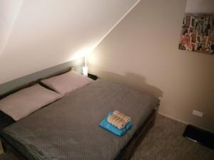 A bed or beds in a room at APARTMÁNY PIETRO