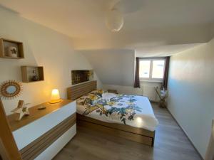 Posteľ alebo postele v izbe v ubytovaní Appartement agréable à Malo proche de la plage