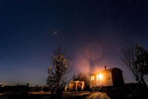 a cabin under a starry sky at night at Astronomer Shepherd's hut in Beaminster
