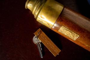 a golden gun with a key on a table at Astronomer Shepherd's hut in Beaminster