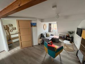 Televízia a/alebo spoločenská miestnosť v ubytovaní Appartement agréable à Malo proche de la plage