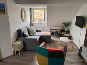 Televízia a/alebo spoločenská miestnosť v ubytovaní Appartement agréable à Malo proche de la plage