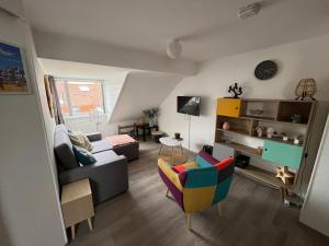 Televízia a/alebo spoločenská miestnosť v ubytovaní Appartement agréable à Malo proche de la plage