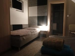 A bed or beds in a room at APARTMÁNY PIETRO