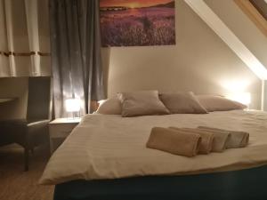 A bed or beds in a room at APARTMÁNY PIETRO