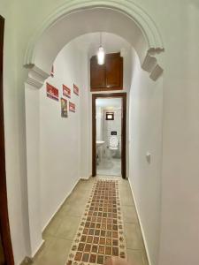 an archway leading to a bathroom with a toilet at Ali Apart in Antalya