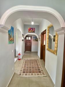 a hallway with an archway in a house at Ali Apart in Antalya