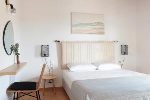 מיטה או מיטות בחדר ב-Onar Houses