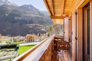 a balcony with a view of the mountains at B&B Chalet Il Picchio in Varzo