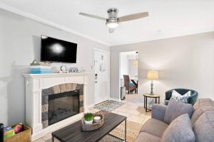 a living room with a couch and a fireplace at 5 MIN WALK TO BEACH- 2BR1BA Villa in The Dunes in Hilton Head Island