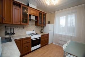 A kitchen or kitchenette at DELUX "Удобно в аэропорт"