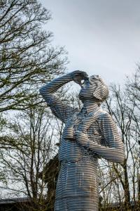 a statue of a man in a striped suit at The Landing Hotel in Westerham