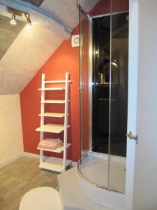 a bathroom with a shower in a attic at La Roseraie du Prieure in Rosay-sur-Lieure +22 photos