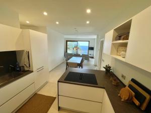 A television and/or entertainment centre at Cokkinis villa with garden overlooking the sea
