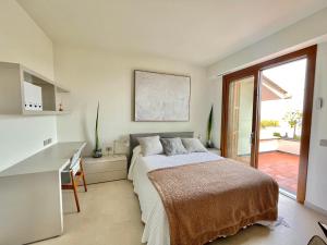 A bed or beds in a room at Cokkinis villa with garden overlooking the sea
