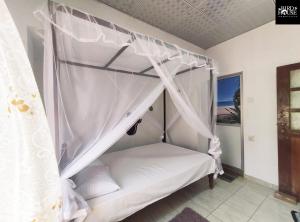 Postel nebo postele na pokoji v ubytování Bird House Homestays