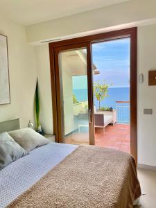 A bed or beds in a room at Cokkinis villa with garden overlooking the sea