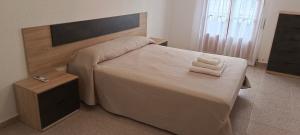 Postel nebo postele na pokoji v ubytování El Hogar de Juan Ramón