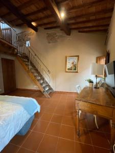 a room with a bed and a staircase at Da Giulia in Florence