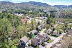 an aerial view of a home with mountains in the background at Spacious Mountain House - 10 minutes from Asheville & Biltmore! in Asheville