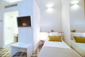 Posteľ alebo postele v izbe v ubytovaní Feelathome Casa Bertrand