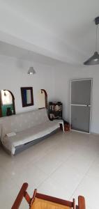 a large white room with a large bed in it at The Cozy Yard in Nea Potidaea