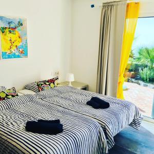 Ένα ή περισσότερα κρεβάτια σε δωμάτιο στο Tenerife Nature Retreat