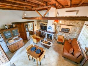 an overhead view of a living room with a fireplace at Relaxing Sea View Home in Kalandra