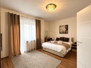 a bedroom with a bed and a large window at Holiday house "Mimoza" 2 massage pools in Otočac +43 photos