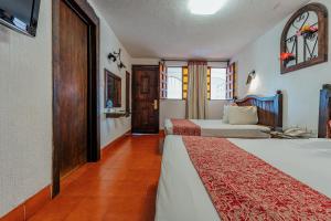Postel nebo postele na pokoji v ubytování Hotel Maya Yucatan + 37 fotografií