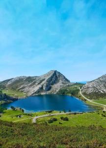 a crater lake in the middle of a mountain at Apartamentos Begoña in Llanes