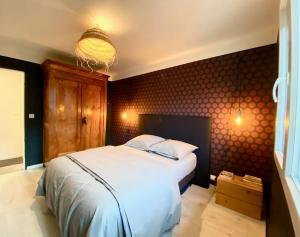 Posteľ alebo postele v izbe v ubytovaní Appartement chaleureux entre Zola et Procé.