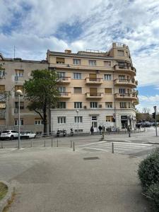 a large building on a street in front of a building at BRAND NEW City Center Apartment Nostalgija in Split