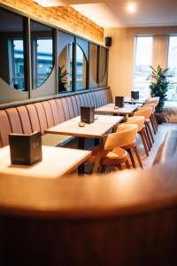 a row of tables and chairs in a restaurant at The Nines in Bangor