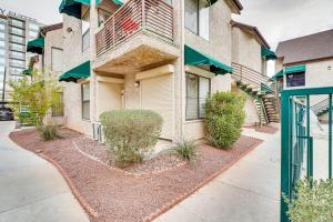 a apartment building with plants in front of it at Vacation Rental Near Las Vegas Strip With Pool! in Las Vegas