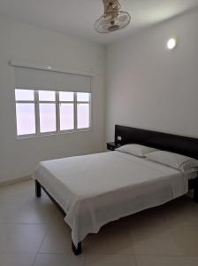 Postel nebo postele na pokoji v ubytování HOTEL SAN ADOLFO