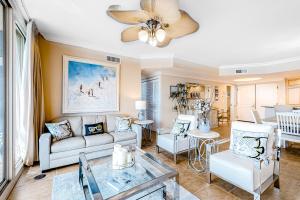 a living room with a couch and a table at Portofino #2009 in Pensacola Beach