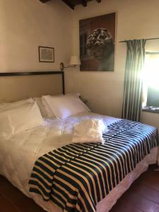 Postel nebo postele na pokoji v ubytování Albergo Le Casaline