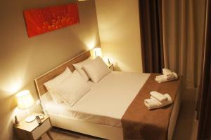 Säng eller sängar i ett rum på Privilege Apartment Corfu Town