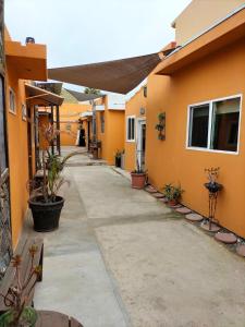 a walkway outside of a house with plants at Casa Edka in Ensenada