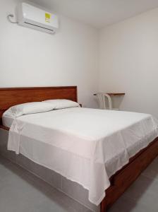 Postel nebo postele na pokoji v ubytování HOTEL SAN ADOLFO