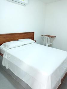 Postel nebo postele na pokoji v ubytování HOTEL SAN ADOLFO