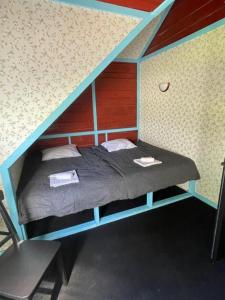 Cama o camas de una habitación en Nõva Külalistemaja