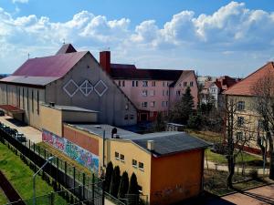 a group of buildings with graffiti on them at Apartament Mazury in Giżycko