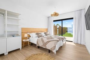 Postel nebo postele na pokoji v ubytování Villa Ayala + 37 fotografií