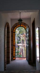 an archway with an open door to a house at Ideal Ixtapan in Ixtapan de la Sal +4 photos