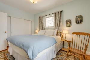 a bedroom with a bed and a chair and a window at Burley Home with Playground - 1 Mi to Golf Course! in Burley